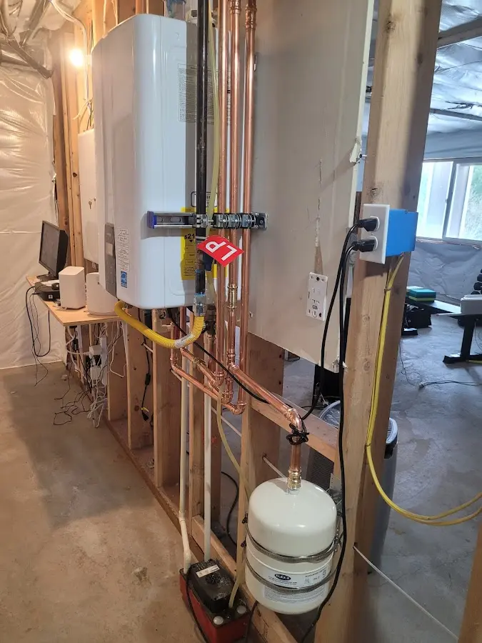 Licensed plumber repairing a kitchen sink in Seattle