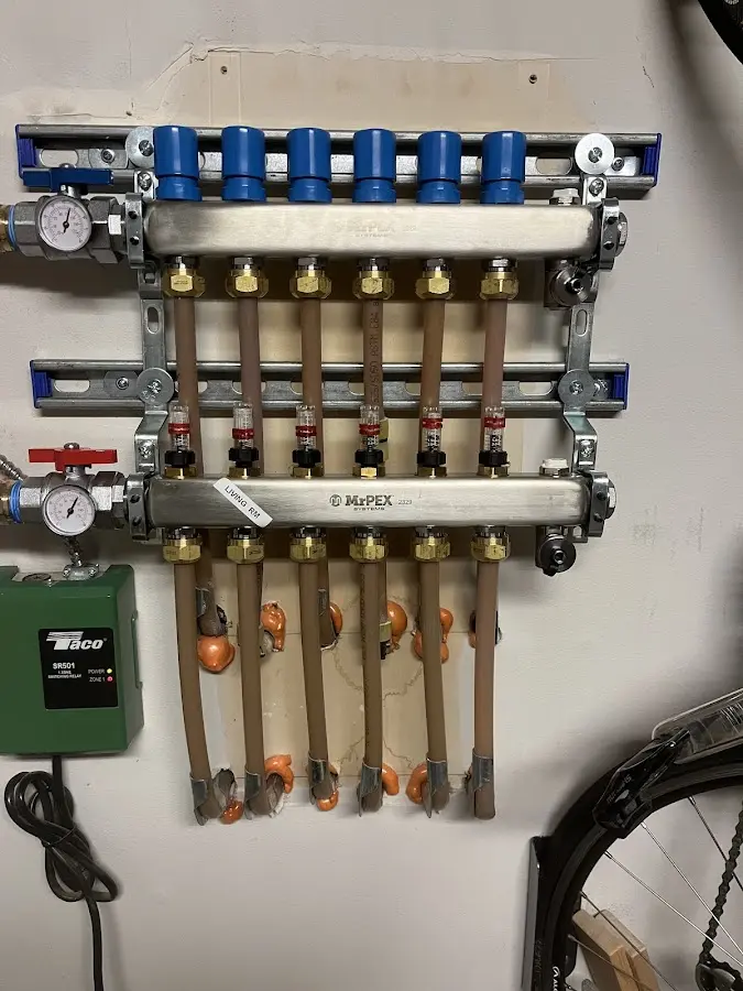 Plumber performing Water Heater Repair at a residential property in Seattle